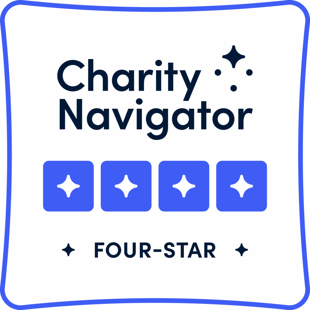 Charity Navigator Four-Star rating badge with star icons and the text "Charity Navigator" and "FOUR-STAR" on a white background with a blue border.