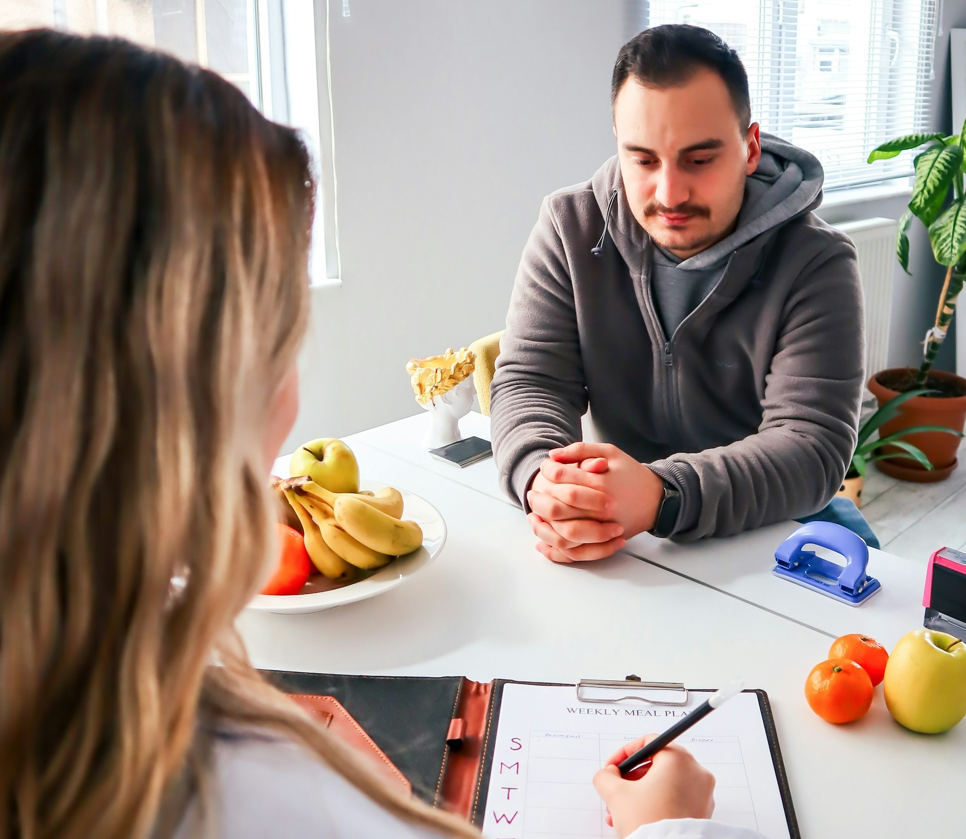 A person working with a dietitian during a one-on-one consultation.