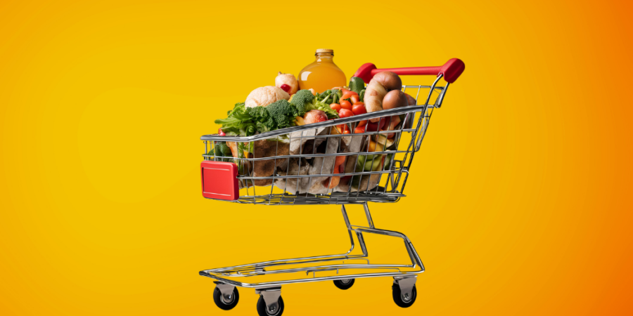 A shopping cart filled with groceries, including vegetables, bread, eggs, and a bottle, against a bright orange background.
