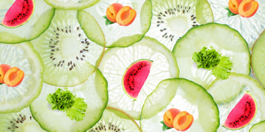 A colorful pattern of overlapping cucumber and kiwi slices, garnished with small pieces of lettuce, apricot halves, and watermelon wedges on a bright background.