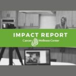 Black and white photo of a woman in a kitchen, with a camera and open laptop in the foreground. A green banner across the center reads "IMPACT REPORT Cancer Wellness Center.