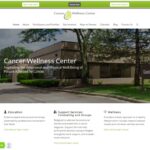 Screenshot of the Cancer Wellness Center website homepage, featuring navigation menus, a green donate button, a chat option, and information about education, support services, and wellness for people affected by cancer.